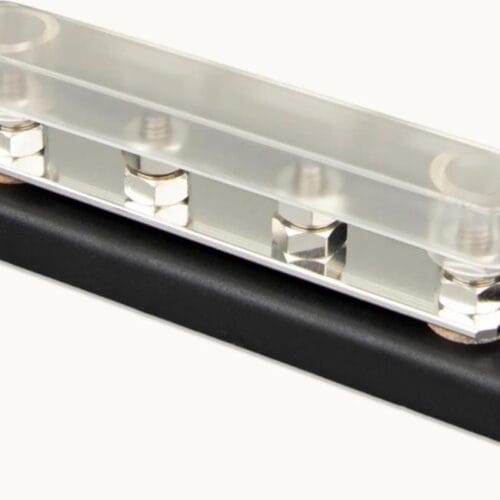 Strömfördelningsblock med transparent skydd och metallanslutningar